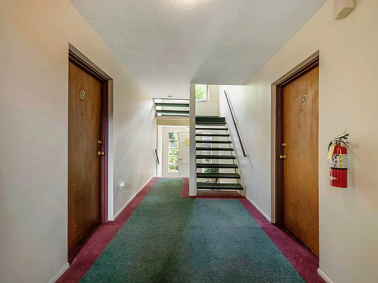 Four units on each floor with common entry hall way accessed from parking lot
