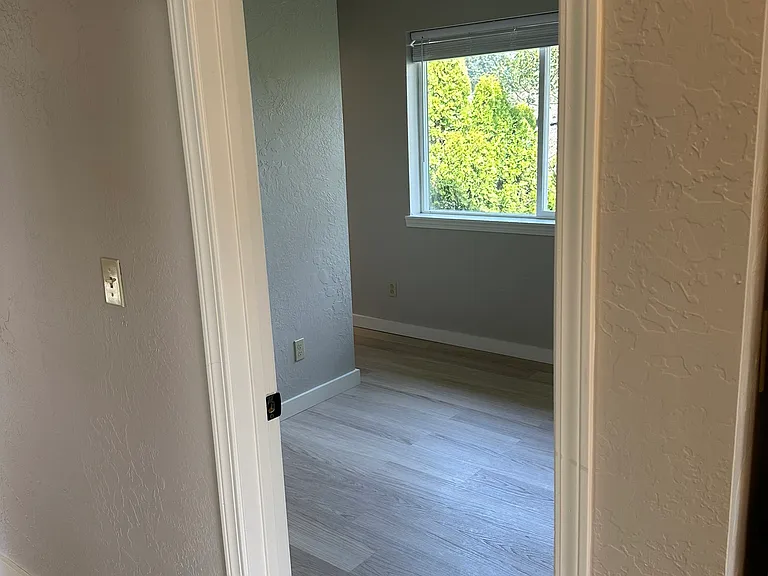 Bedroom #2 entrance with lots of natural light and shades