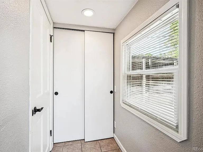 Hallway to backyard + closet space