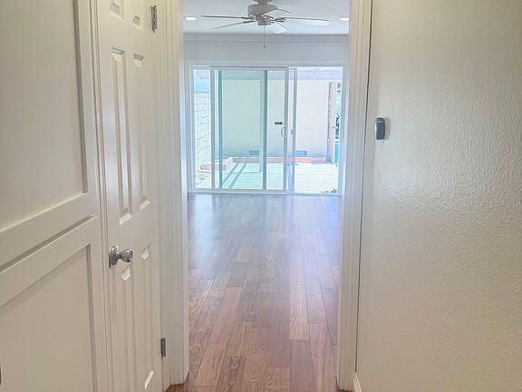 Hallway from front door to hall closet, 1/2 bathroom and dining room