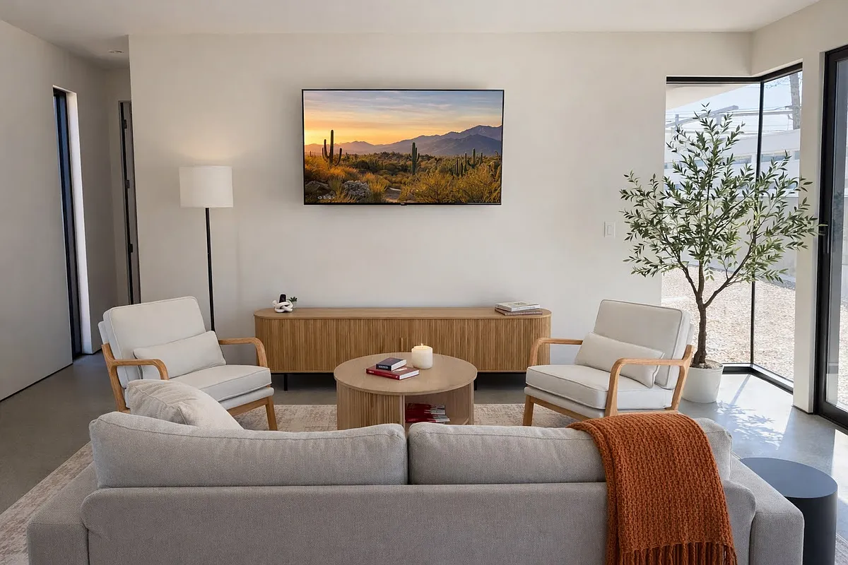 Photo 1 of 10 - 6002 E Charter Oak Rd #2 - Scottsdale, AZ Light-filled living space with comfortable seating, modern decor, and large windows that bring the outdoors in without the heat. - 6002 E Charter Oak Rd #2