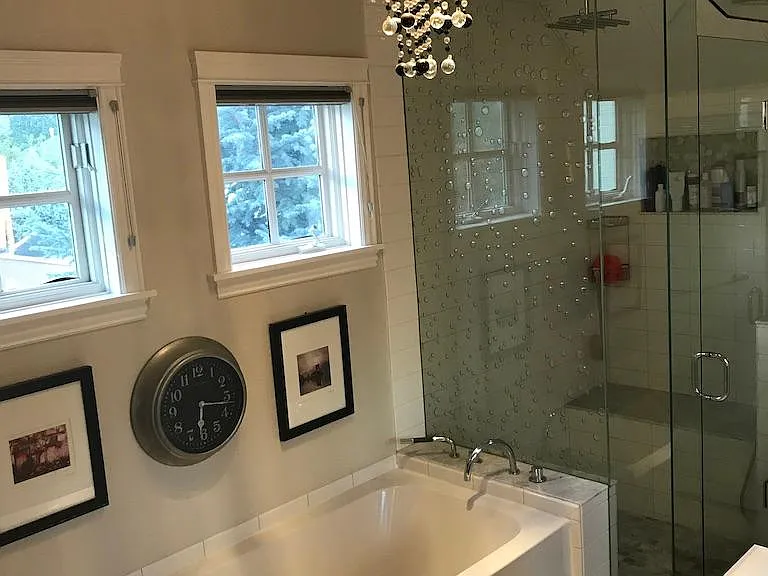 oversized deep tub and steam shower plus full bidet with heated seat. single sink with outlets underneath and hidden (for dryer connection, etc)