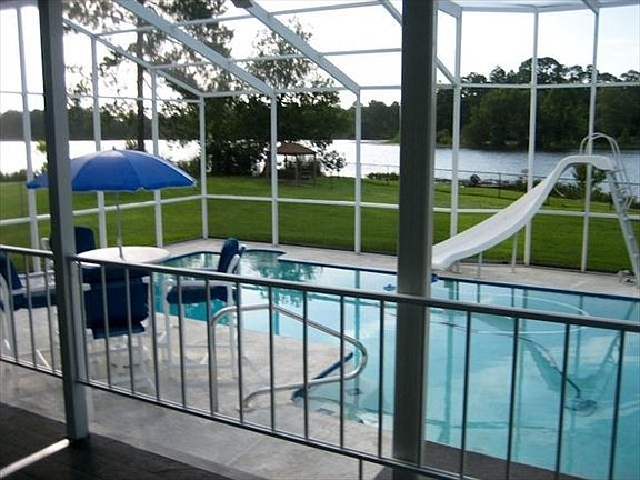 Porch overlooking pool and lake