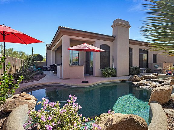 Zen-like backyard features heated pool, spa and waterfall!