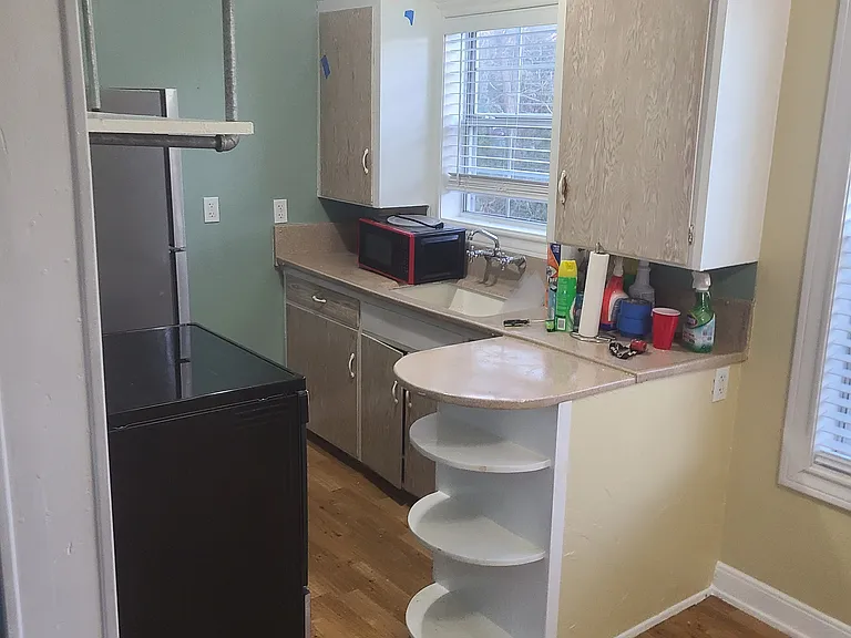 Kitchen from living room. Dining area to the right.