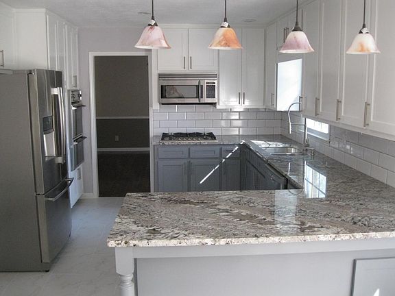 granite counter tops, stainless appliances, under mount cabi