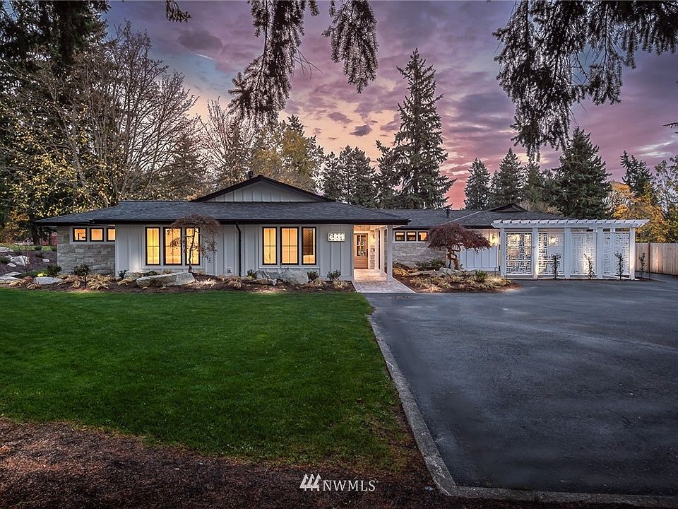 A spectacular 2.41 acre estate with gorgeous updated rambler and enormous shop.