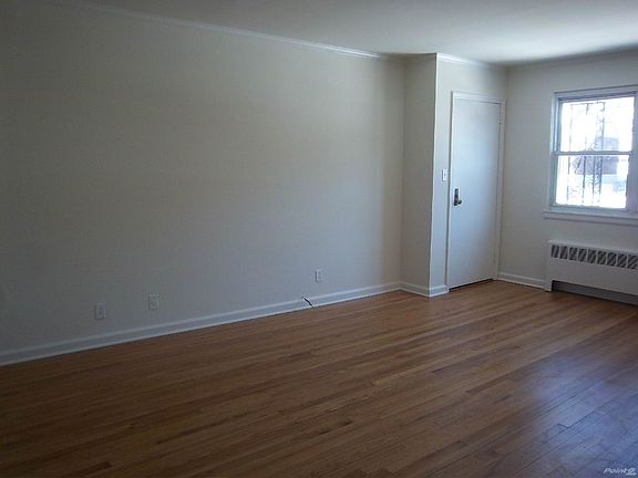 Living Room w. Entrance Door... freshly painted throughout..