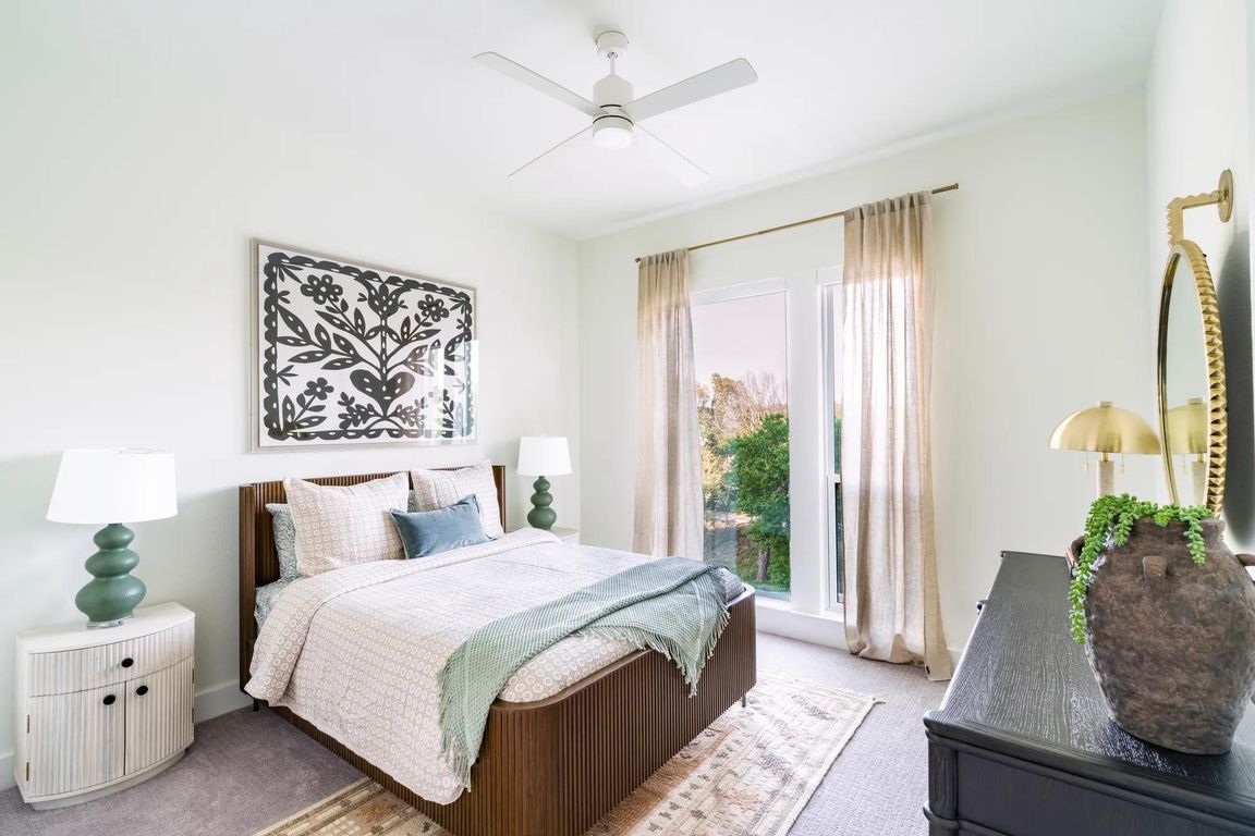 Bright and airy bedrooms at Modera Trailhead feature oversized windows and refined finishes, creating a restful retreat in Dallas.