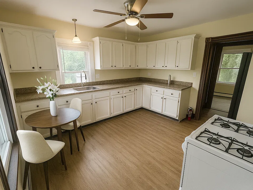 Spacious updated kitchen with plenty of cabinet storage and room for dining (virtually staged).