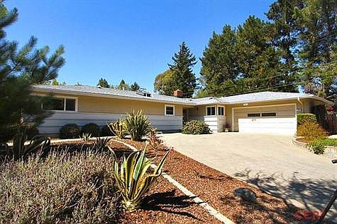 Front view of home; large corner lot.