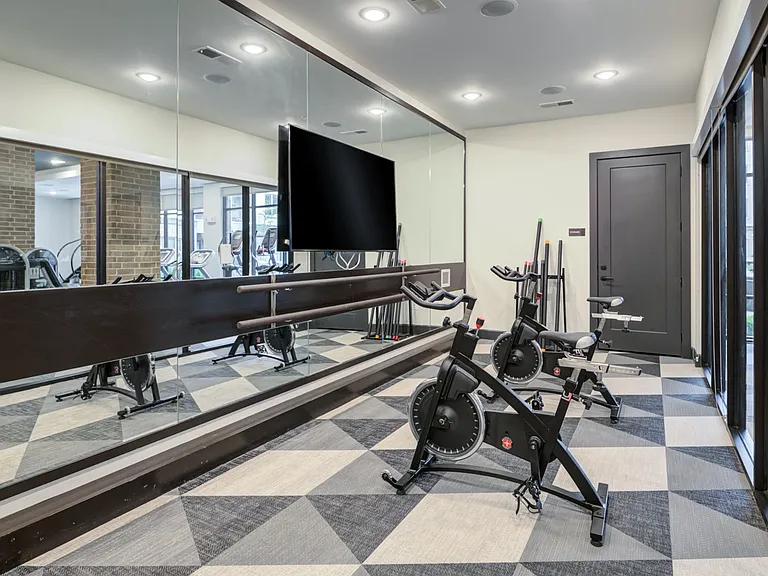 Dedicated Spin and Barre Room With Floor-to-Ceiling Mirrors