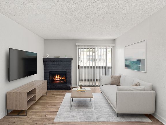 Furnished Living Room with Fire Place at South Lamar Village Apartments in Austin, TX 78704