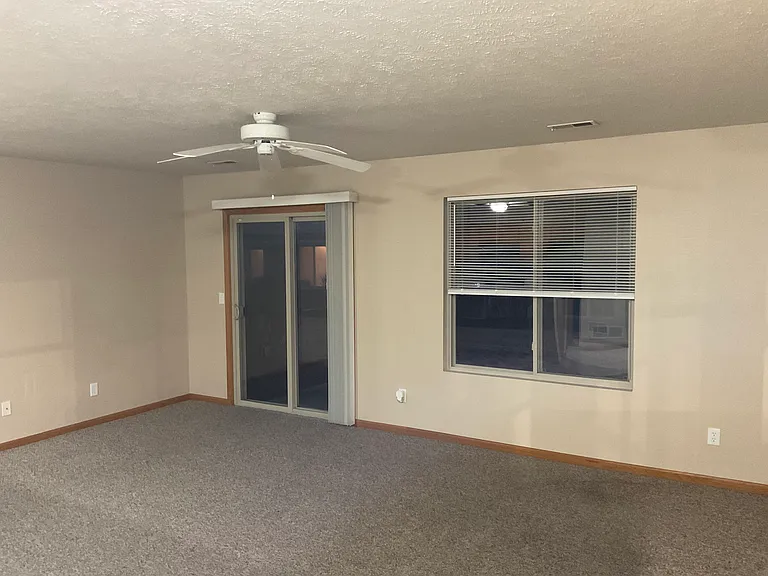 Extra large living room, with a sliding patio door to private patio