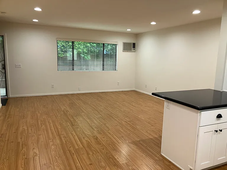 The great-room includes living room and kitchen.