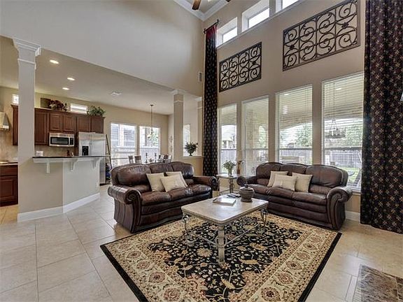 View featuring living room, breakfast area, kitchen, and outdoor living.