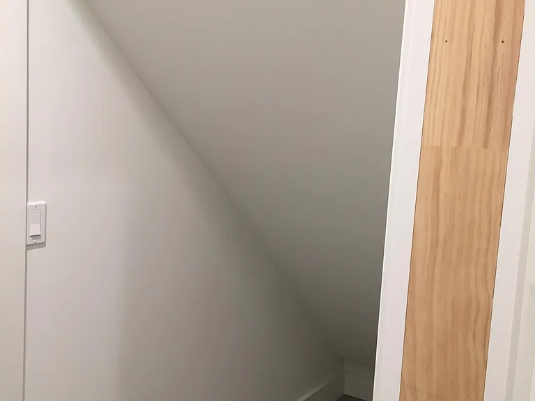 Storage opposite laundry.