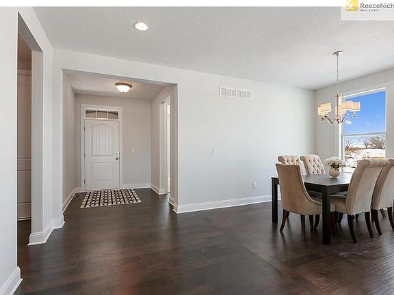 Home feels open from the moment you enter.  A modern take on a dining room leaves it open to the rest of the home.