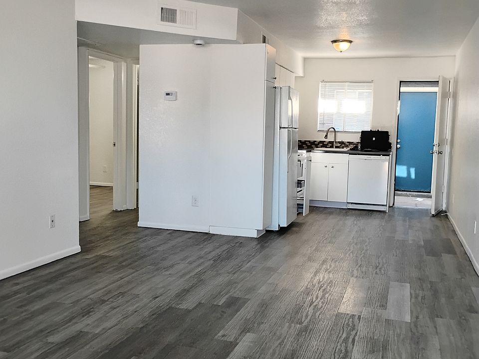 Far view of kitchen, dinning, and living areas