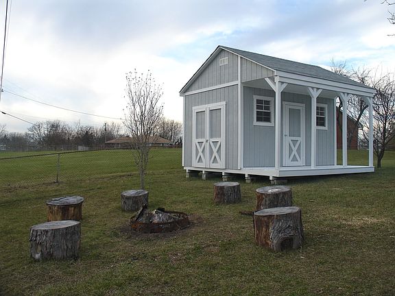 Storage Shed/Playhouse with Campfire Area