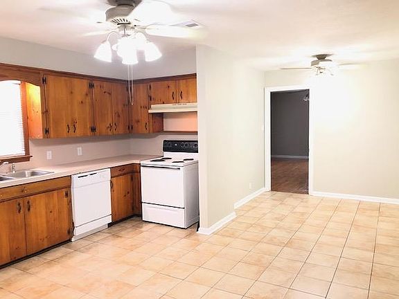 LARGE OPEN KITCHEN AND DINING AREA