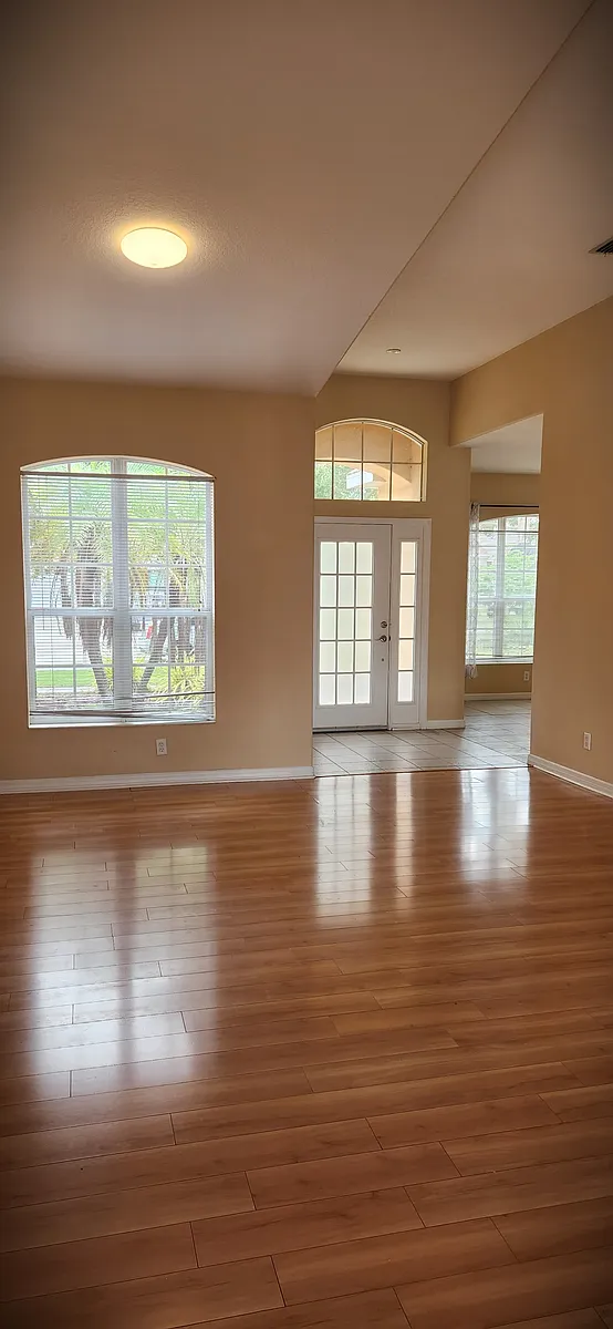 open floor plan of entrance, living area, and open side room - 1712 Mellon Way