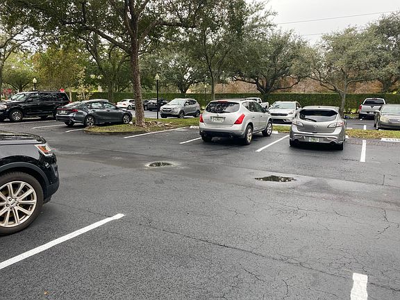 2nd spot from the right of the tree is reserved spot