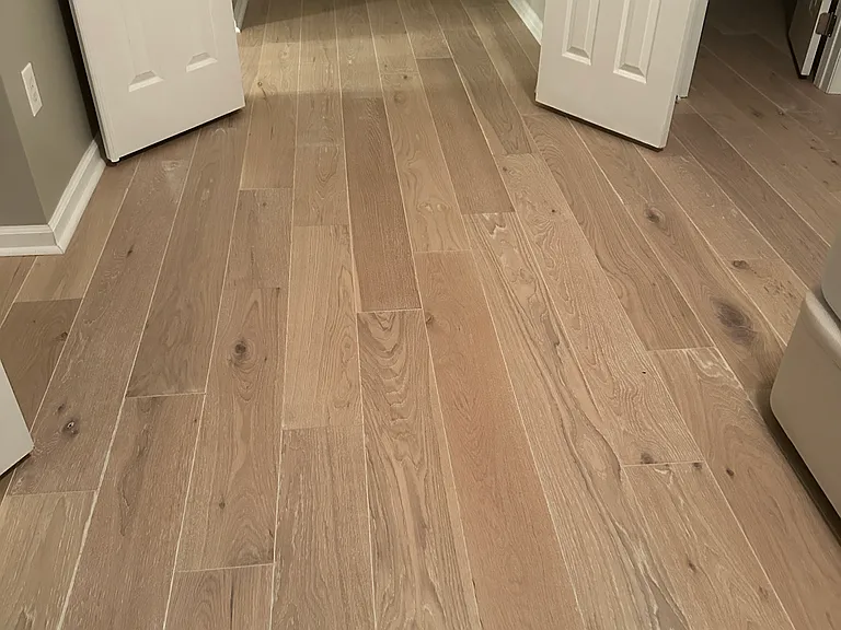 Brand new hardwood flooring on top floor with three bedrooms and two full bathrooms