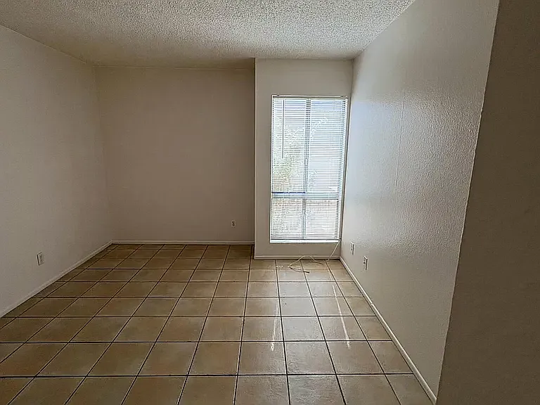 Large bedroom with tile