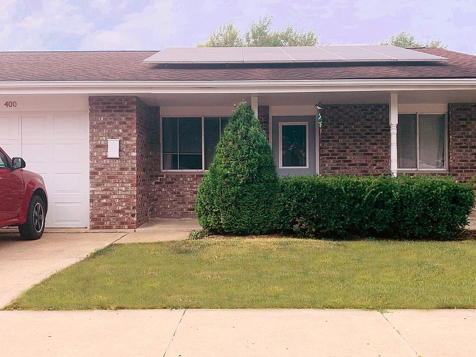 East entrance, attached walk in one car garage. Ample on street parking.
