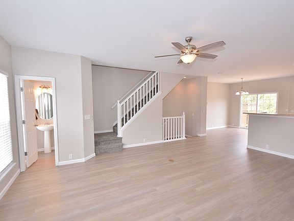 Living room with access to powder room on the main level
