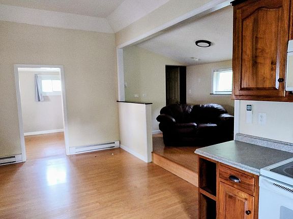 Kitchen/living/dining area looking into bedroom