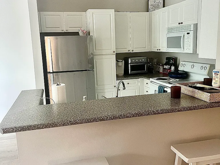 Bar seating, appliances have been updated.