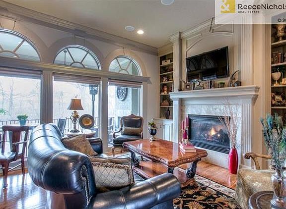 Great Room is Bright and Airy with Instant Start Fireplace, Extensive Moldings, Custom Window Treatments, Built In's and Surround Sound.