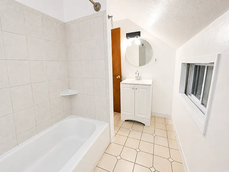 Full bathroom with tub and vanity