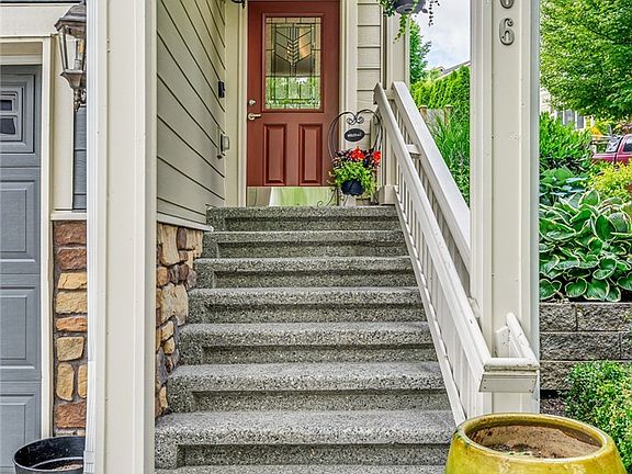 Easy to maintain, exposed aggregate steps and driveway. Covered porch.