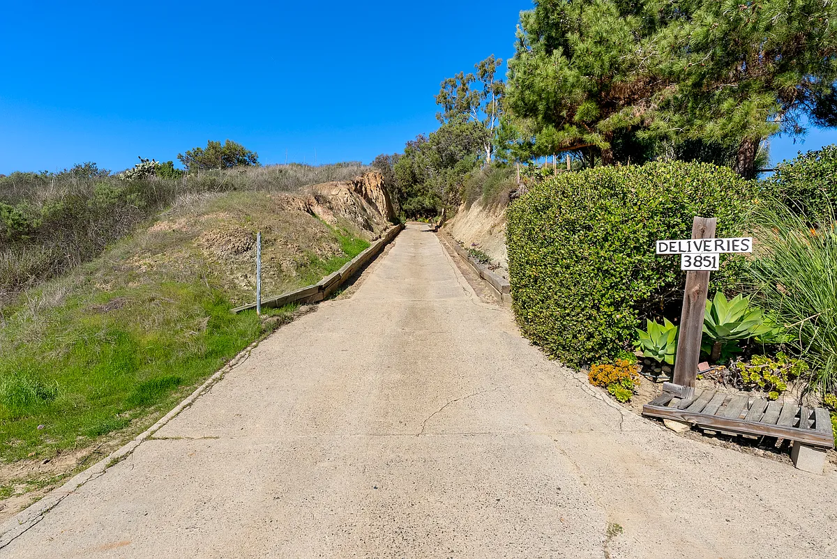 Private sandstone driveway entrance leading to the peaceful hilltop retreat. - 3851 Manchester Ave