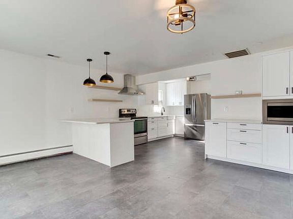 eating area with coffee bar with built in microwave
