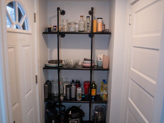Additional pantry storage at back door to the house.
