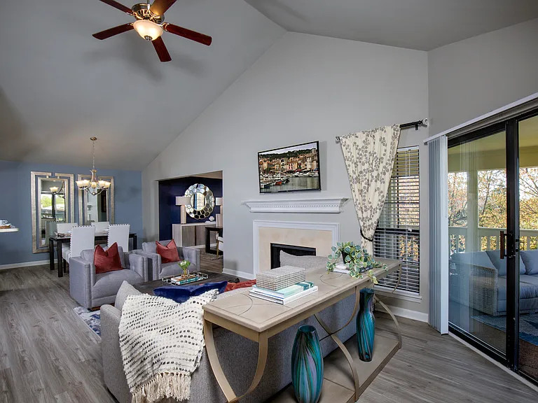 Living room with vaulted ceiling and fireplace
