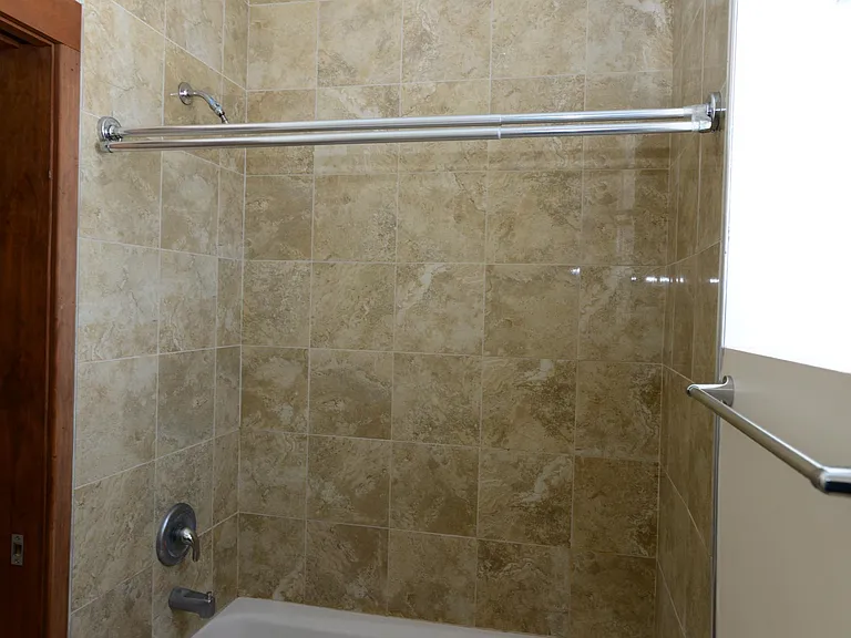 Bathrooms completely replaced with modern water saving fixtures, floor to ceiling tile.