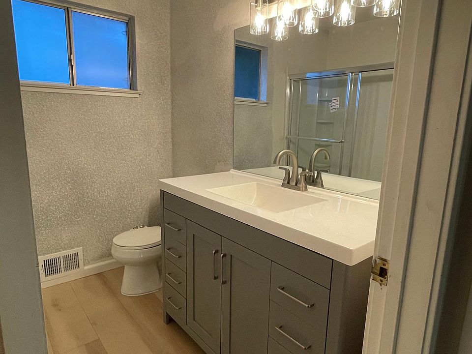 One bathroom in unit. fully remodeled bathroom new vanity, mirror, lights, fan, bath tub over shower, and flooring.