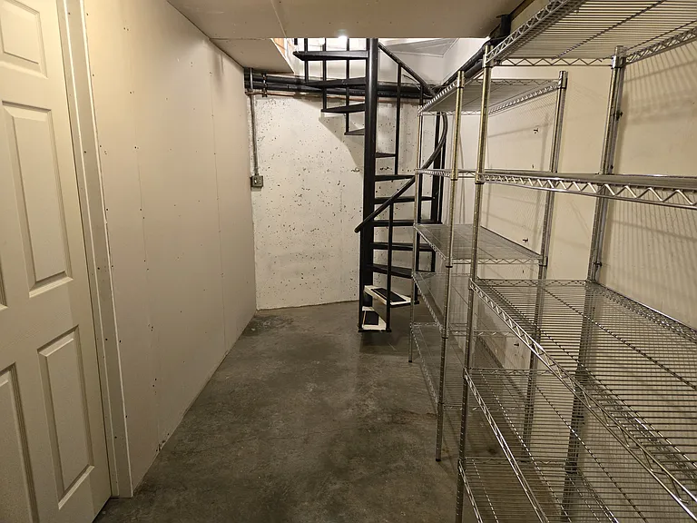 Spiral staircase to downstairs basement and laundry room