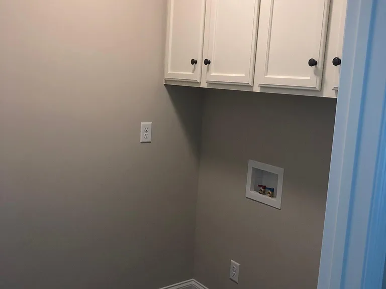 Laundry room right off kitchen and next to back door. Will