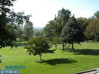 Over .6 acres of south exposure w/ lots of fruit trees. Subdivision possible