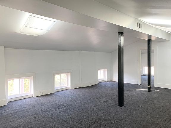 open plan living room / kitchen - view upon entry