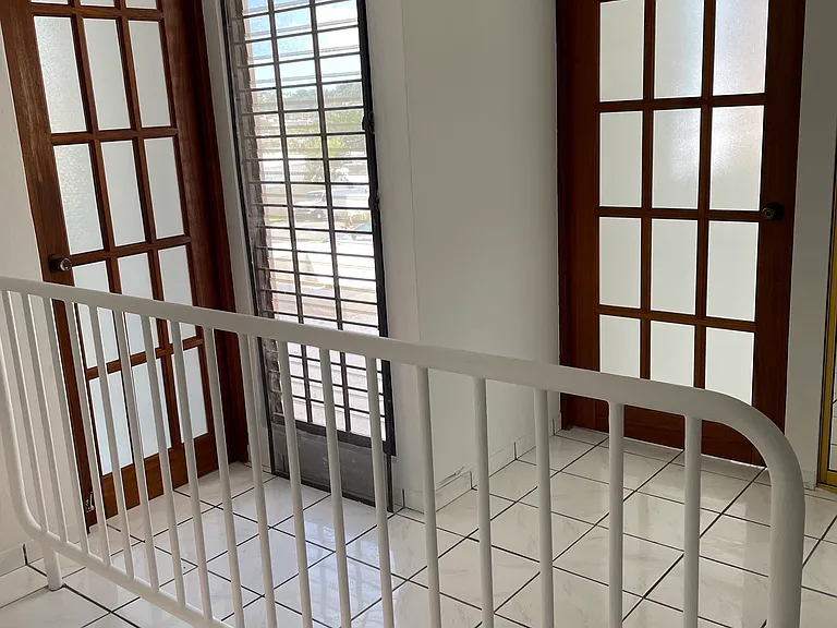Upstairs area, doors to bedroom