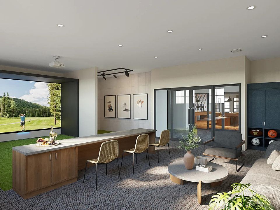 Practice your swing or perfect your shot in the multi-sport simulator lounge at Modera South Shore apartments.