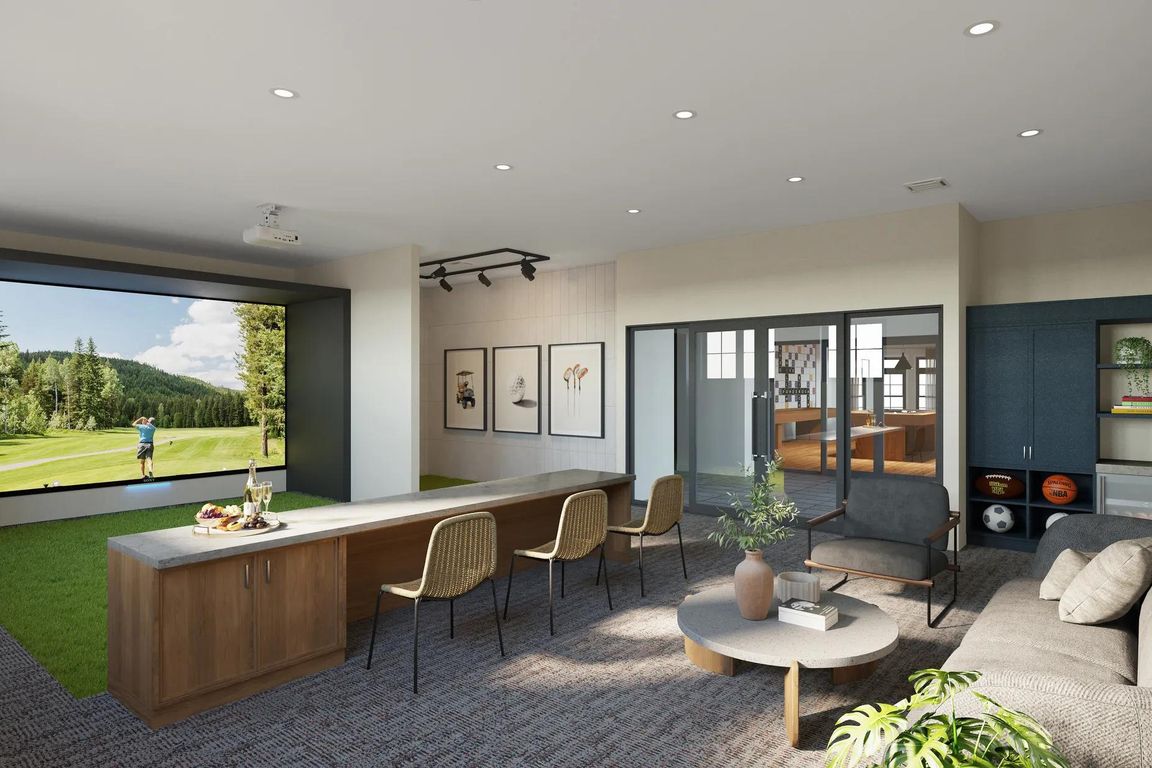 Practice your swing or perfect your shot in the multi-sport simulator lounge at Modera South Shore apartments.