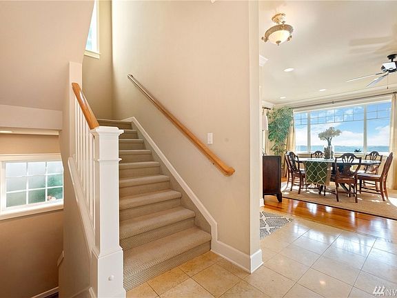 Wide staircase to basement and up to 2nd floor.  Views from the Sound.
